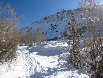 Scenic view of snow covered mountains against sky