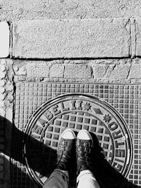 Woman standing on wall