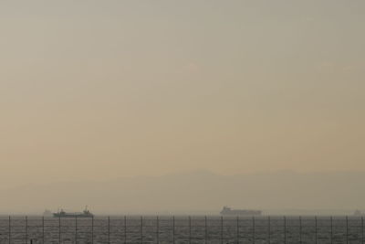 Scenic view of sea against clear sky during sunset