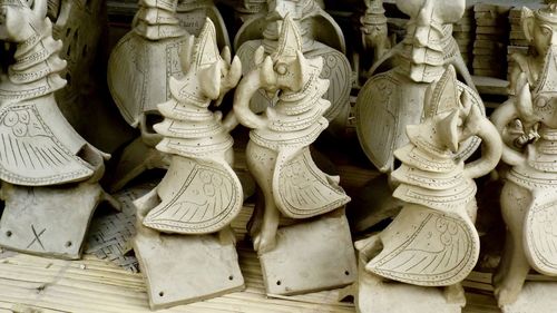 Close-up of statues for sale