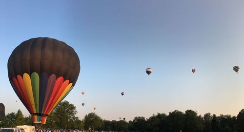 Low angle view of hot air balloons against sky