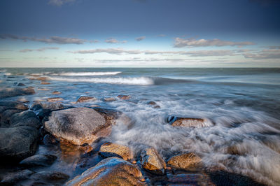 Scenic view of sea against sky during sunset