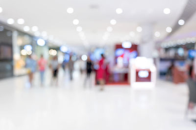 Defocused image of people waiting at night