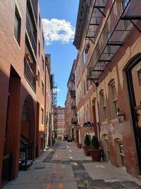 Alley amidst buildings in city