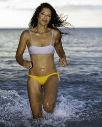 Young woman in bikini on beach