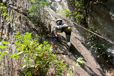 Man standing on rock against mountain