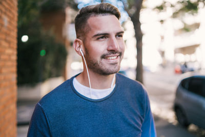 Portrait of young man standing outdoors