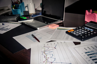 High angle view of various objects on office desk