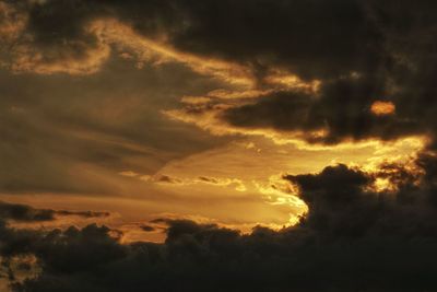 Low angle view of dramatic sky during sunset