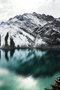 A dreamy view of the mountain and the waters of the dam