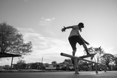 Low angle view of man skateboarding on street