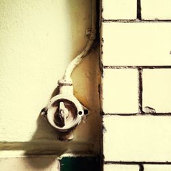 Close-up of pipe on wall