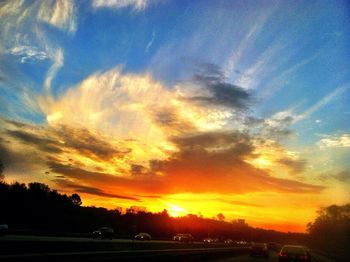 Scenic view of landscape against sky at sunset
