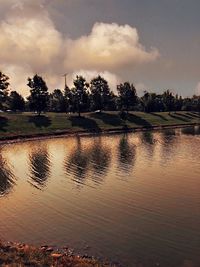 Scenic view of lake against sky during sunset