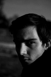 Close-up portrait of young man looking away