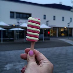 Hand holding ice cream cone