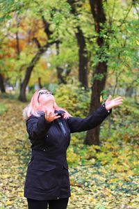 Full length of man standing in park during autumn