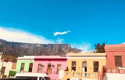 Low angle view of buildings against blue sky