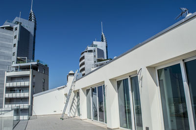 Low angle view of buildings against clear sky