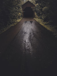 Empty road leading towards tunnel