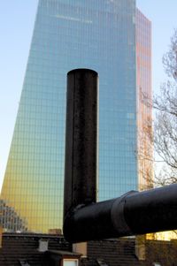 Low angle view of office building against sky