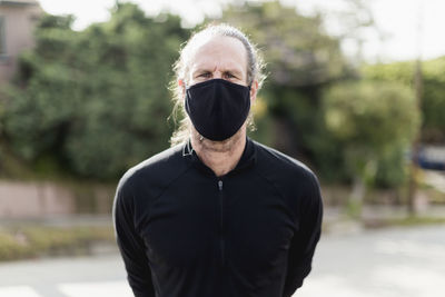 Man wearing black fabric mask