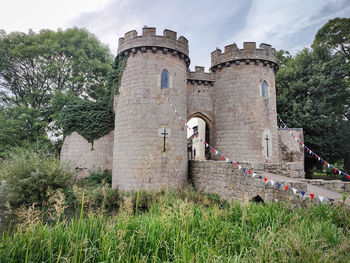 Old ruins of whittington castle against sky