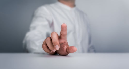 Midsection of doctor holding pills