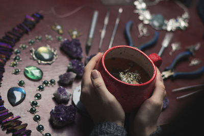 Close up teacup and jeweller instruments photo