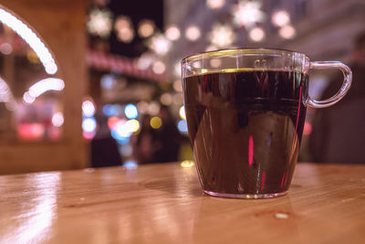 Close-up of mulled wine on table at christmas market