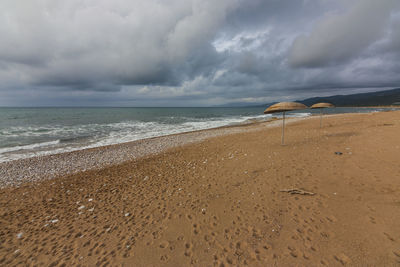 Scenic view of beach against sky