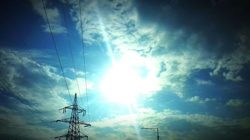 Low angle view of power lines against sky