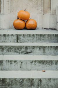 View of pumpkins on stone wall