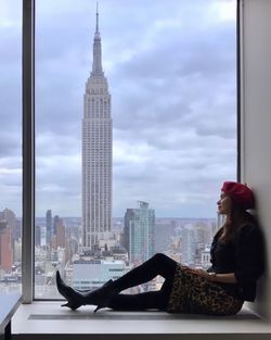 Woman with skyscrapers in background