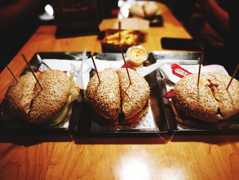 High angle view of hamburgers served on table at restaurant