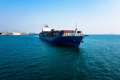 Container cargo ship carrying commercial container import export business delivery service 