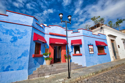 Low angle view of traditional building against blue sky