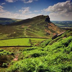 Scenic view of landscape against cloudy sky