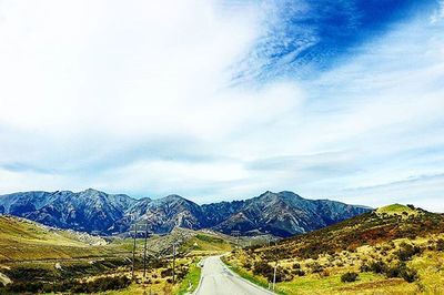 Scenic view of landscape against cloudy sky