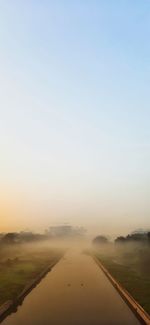 Scenic view of landscape against sky at sunset