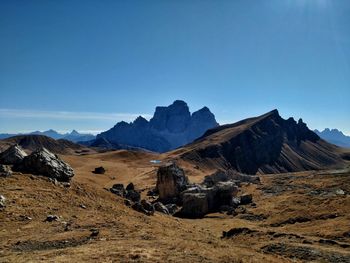 Scenic view of mountains against clear blue sky