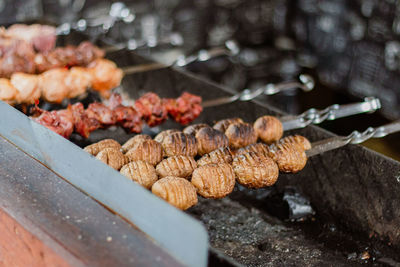 High angle view of meat on barbecue grill