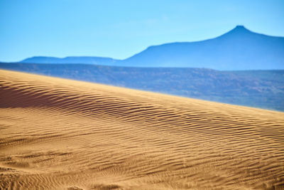 Scenic view of desert against clear sky