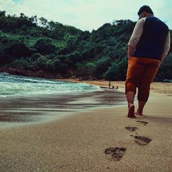 Woman standing on beach