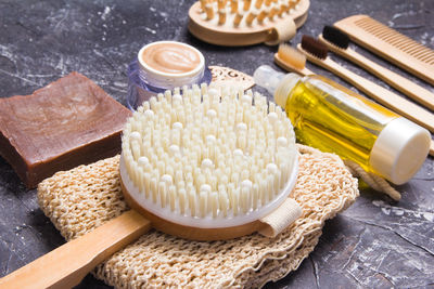 Natural body care products at home, wooden anti-cellulite massage brush eco-friendly lifestyle