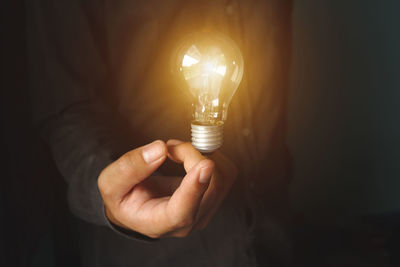 Close-up of illuminated light bulb