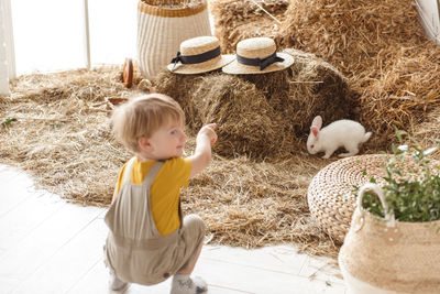 Children at easter with rabbits and ducks