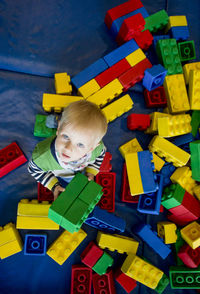 Portrait of cute boy playing with toy blocks