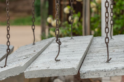 Close-up of swings at playground