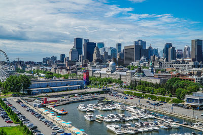 Aerial view of river amidst buildings against sky